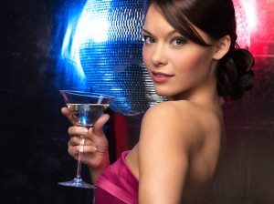 woman with cocktail and disco ball