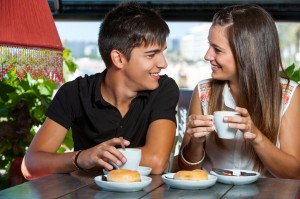 teen couple enjoying coffee together.