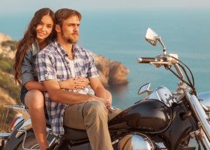 fashion couple sitting on a motorcycle