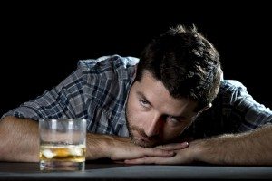 alcoholic man trying to fight against alcohol addiction