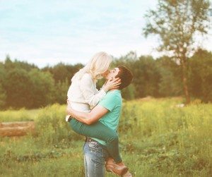Sensual happy couple kissing outdoors