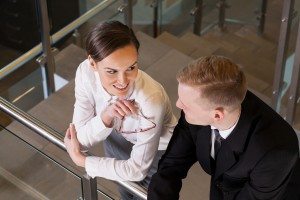 Attractive businesswoman coquetting her co-worker