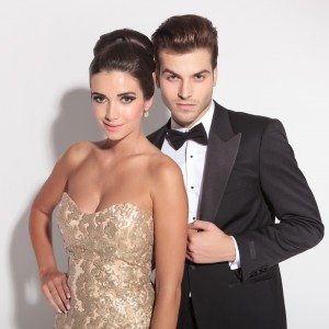elegant couple posing together on studio background