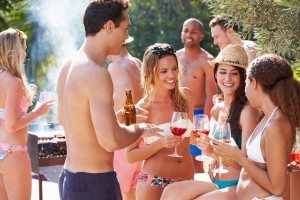 Group Of Friends Having Party By Swimming Pool
