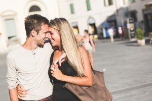 Young Couple in Love meeting and Flirting in Town Square
