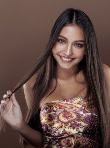 cute happy young indian woman in studio close up smiling, fashio