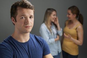 Worried Man Being Talked About By Women