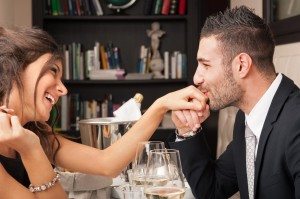 Attractive elegant young couple having romantic dinner at the re