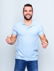 Happy young man in polo shirt