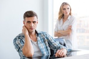 Upset man and woman having problems in relationships